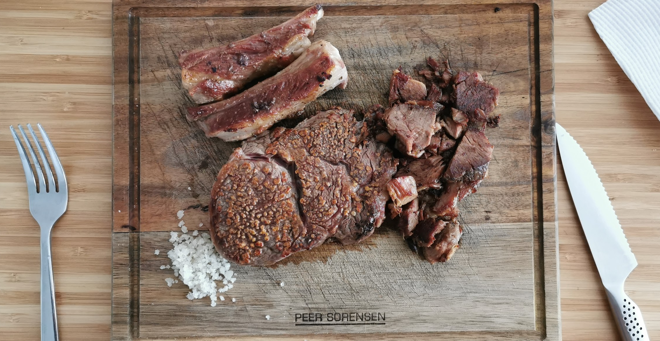 Steak and Lamb Ribs on Wood plate